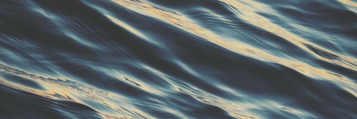 Wide abstract visualization of a flowing river representing steady progress